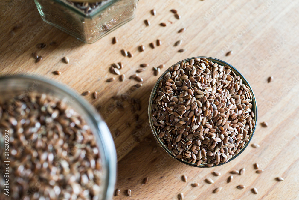 health food linseed flaxseed grain cereal in bowl on wooden table