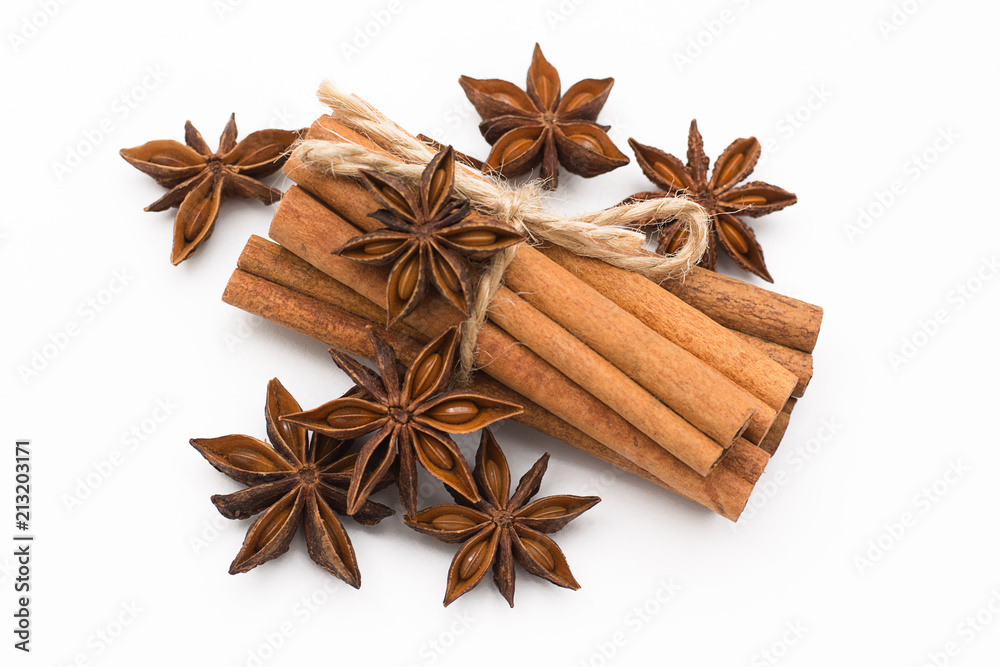 Cinnamon sticks and cardamom on a white background. Aromatic spices. Cinnamon sticks and cardamom on a white background. Aromatic spices.