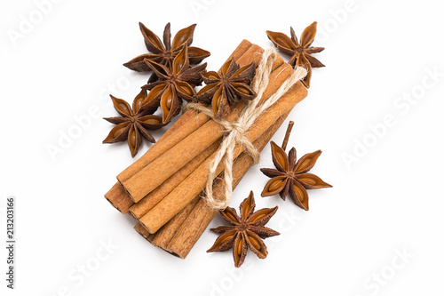 Cinnamon sticks and cardamom on a white background. Aromatic spices.