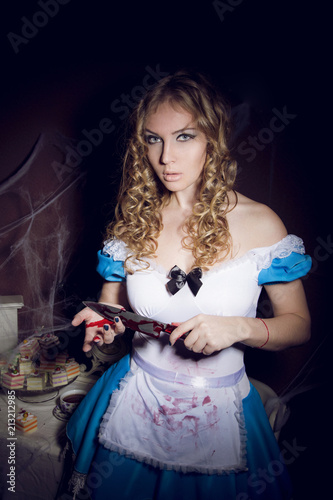 Portrait of a young woman with knife dressed as Alice 