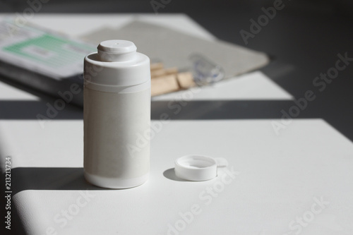 Plastic medicine bottle for powder, homeopathic remedies, pills and tabs.
 photo