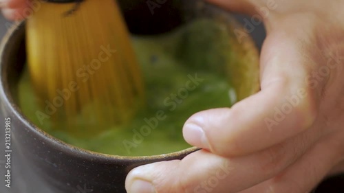 green matcha tea prepearing on stone black table