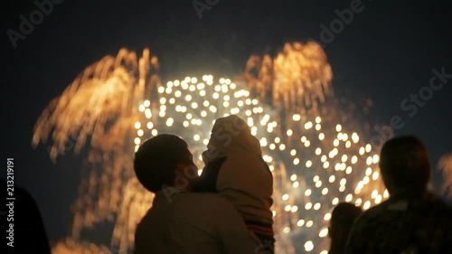 Unrecognizable family fireworks. People are watching fireworks 4k