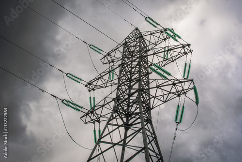 High pressure wire tower at the grey sky, support of power lines