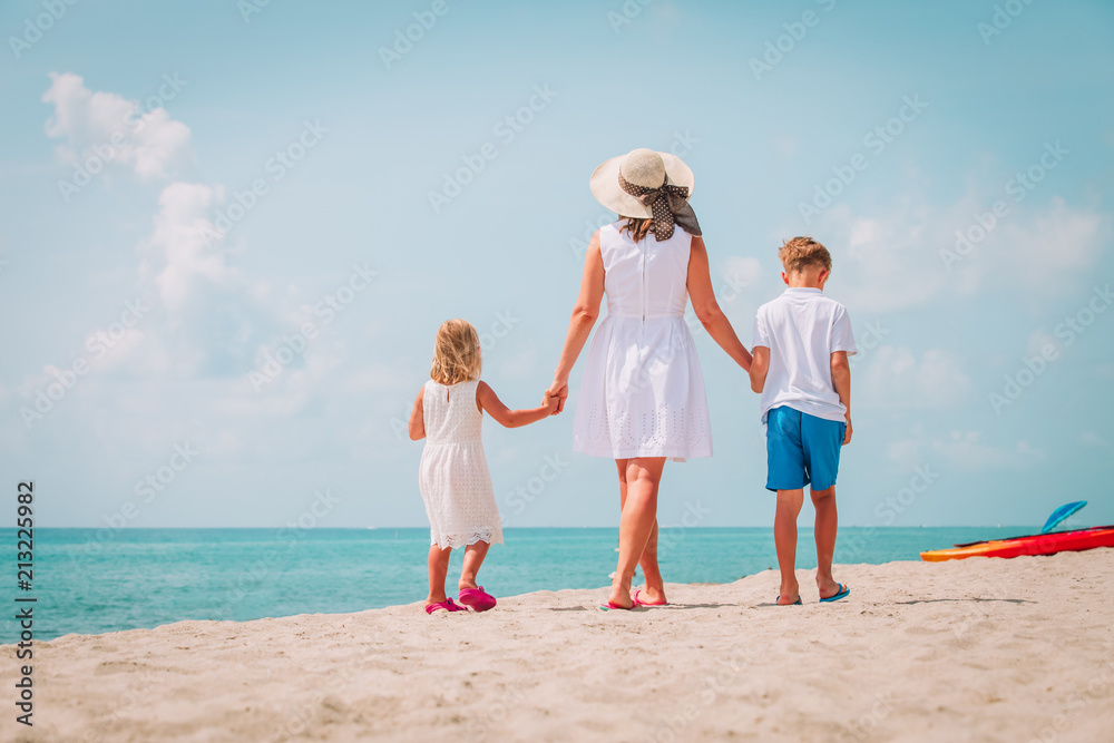 mother with kdis-son and daughter- walking on beach