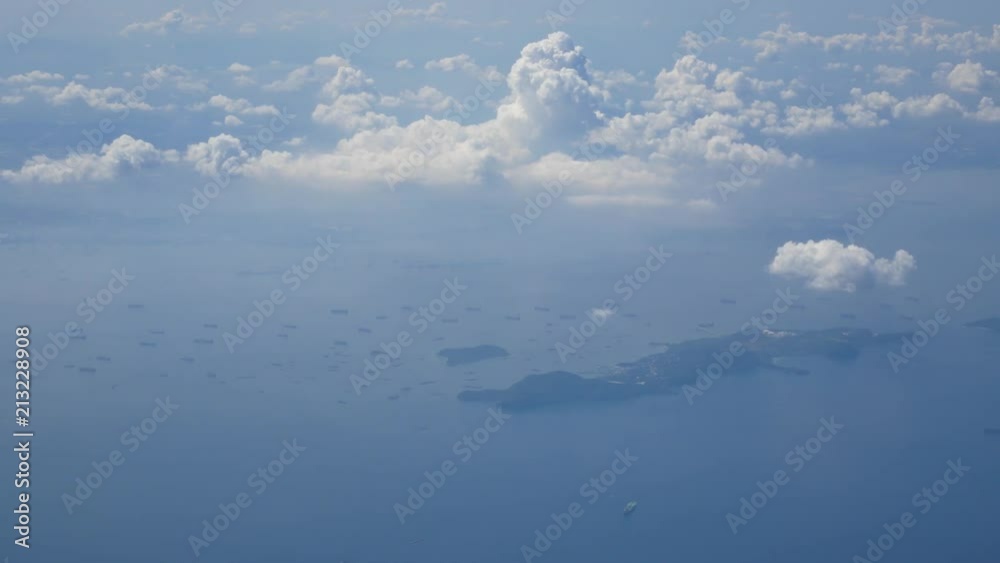 View from inside plane cabin while flying in the sky with landscape of cloudy sky View from inside plane cabin while flying in the sky with landscape of cloudy sky