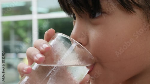 Little Girl Drinking fresh water after play