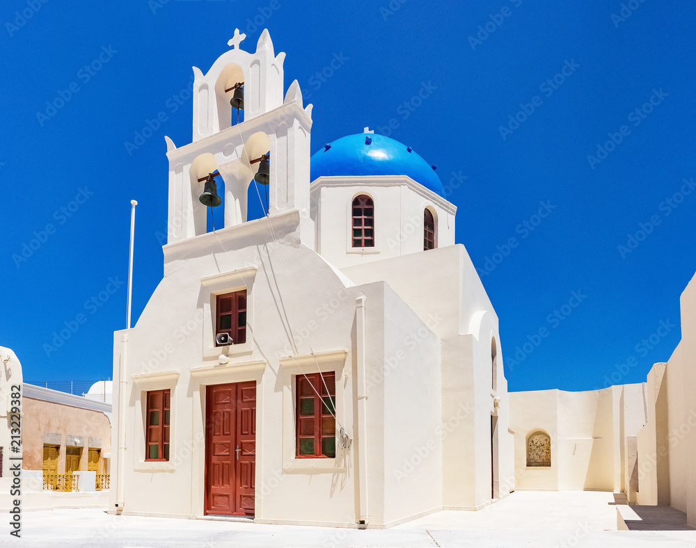 White Church in Imerofigli Santorini Greece under a deep blue sky