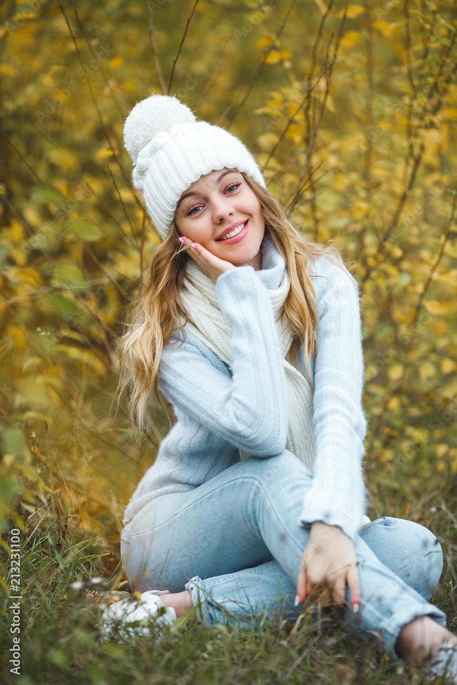 Young attractive woman in autumn colorful background Young attractive woman in autumn colorful background