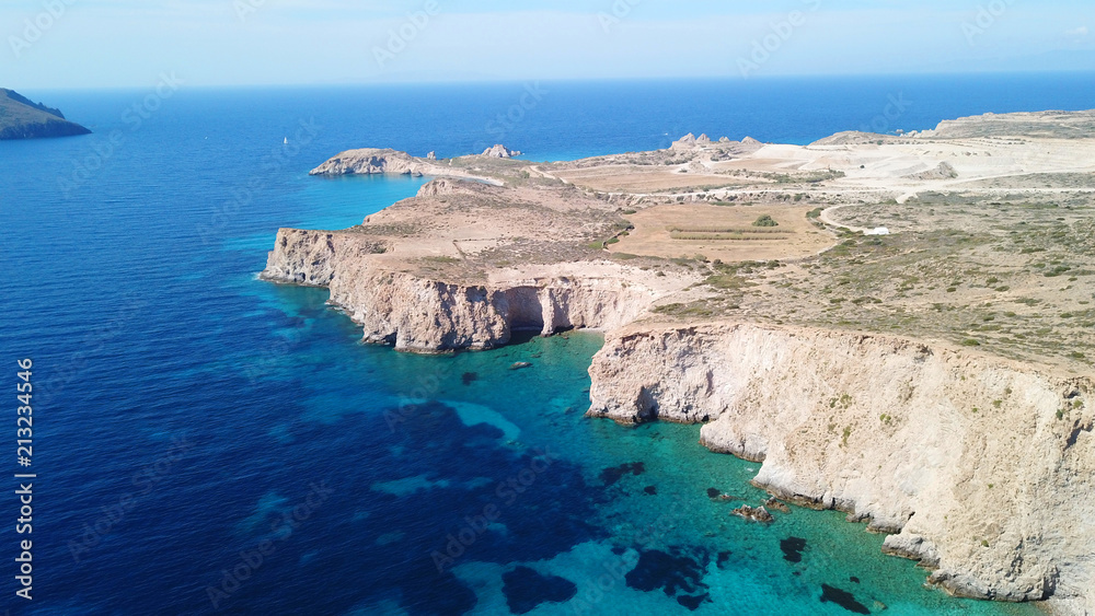 Aerial drone bird's eye view of volcanic and exotic rocky beach with turquoise and sapphire clear waters of Plathiena in island of Milos, Cyclades, Greece Aerial drone bird's eye view of volcanic and exotic rocky beach with turquoise and sapphire clear waters of Plathiena in island of Milos, Cyclades, Greece