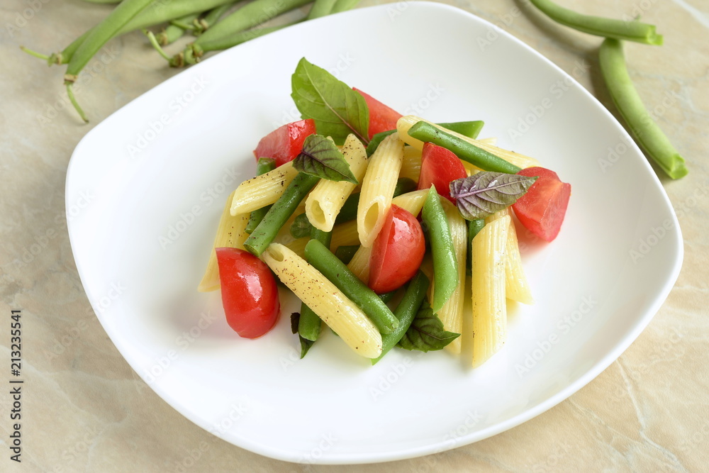 Penne pasta with green beans, cherry tomatoes and basil Penne pasta with green beans, cherry tomatoes and basil