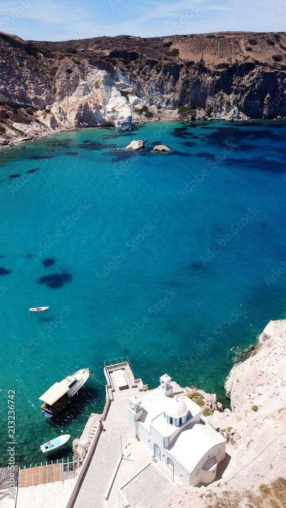 Aerial drone bird's eye view photo of rocky seascape near picturesque fishing village of Firopotamos with turquoise clear waters, Milos island, Cyclades, Greece