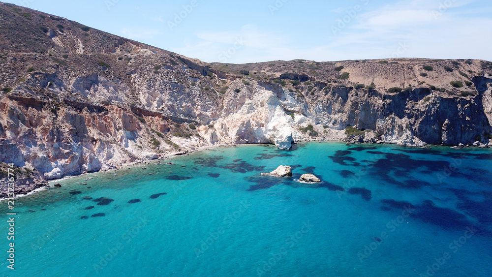 Aerial drone bird's eye view photo of rocky seascape near picturesque fishing village of Firopotamos with turquoise clear waters, Milos island, Cyclades, Greece