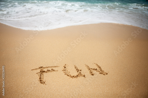 Word FUN in sand of beach