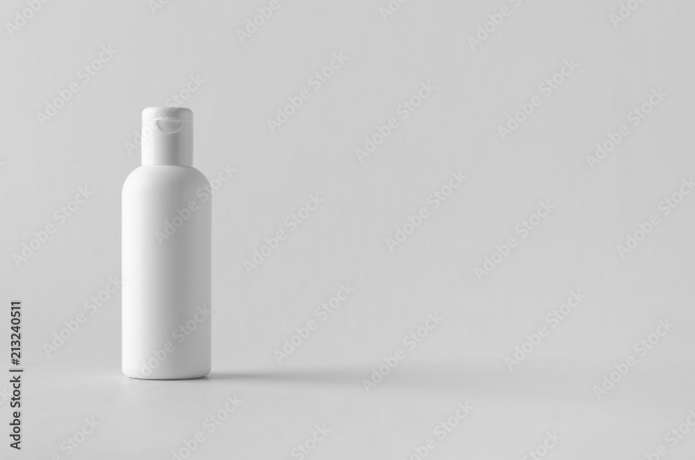 White plastic cosmetic lotion bottle mock-up with cap. White plastic cosmetic lotion bottle mock-up with cap.