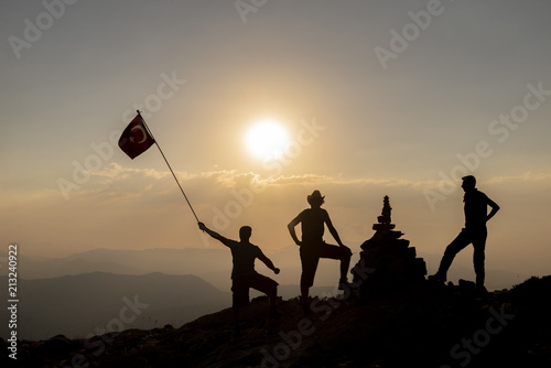 Climber on a summit in the mountains in fog