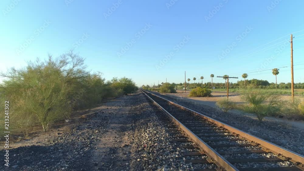 4K Dolly Side Pan of Desert Train Tracks at Sunrise 4K Dolly Side Pan of Desert Train Tracks at Sunrise