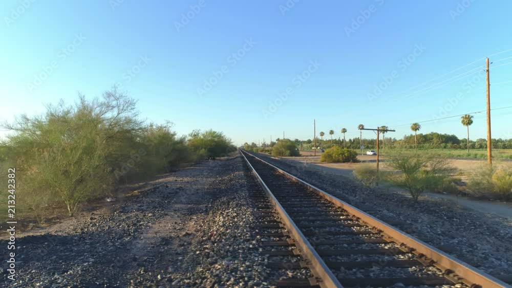4K Dolly Pan of Desert Train Tracks at Sunrise 4K Dolly Pan of Desert Train Tracks at Sunrise
