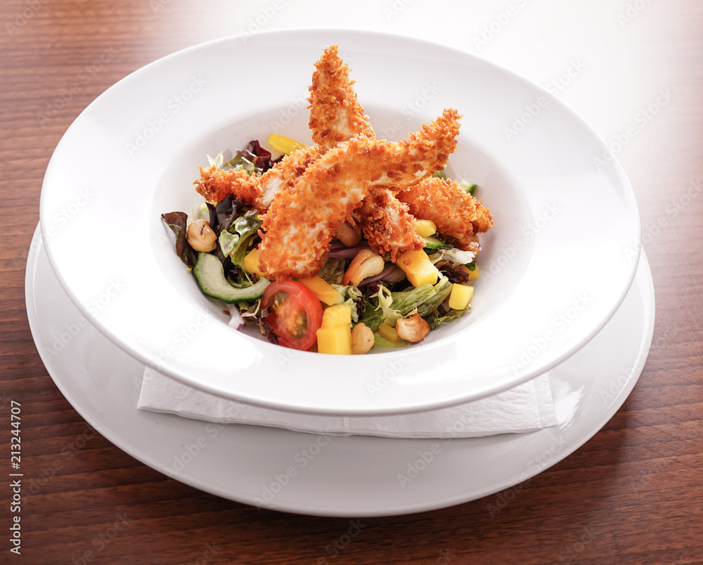 Deep Fried Chicken Goujons Served with a Medley Of Mediterranean Vegetables. Deep Fried Chicken Goujons Served with a Medley Of Mediterranean Vegetables.
