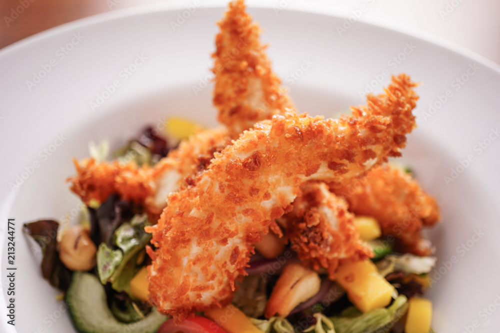 Deep Fried Chicken Goujons Served with a Medley Of Mediterranean Vegetables. Deep Fried Chicken Goujons Served with a Medley Of Mediterranean Vegetables.