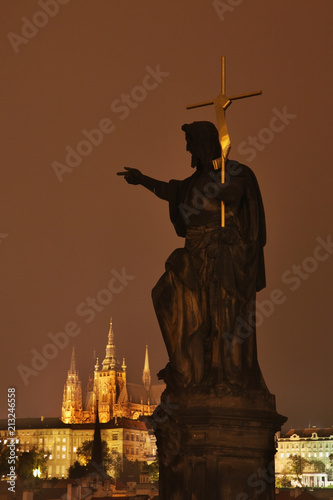Sculpture of John the Baptist at Charles bridge in Prague. Czech Republic
