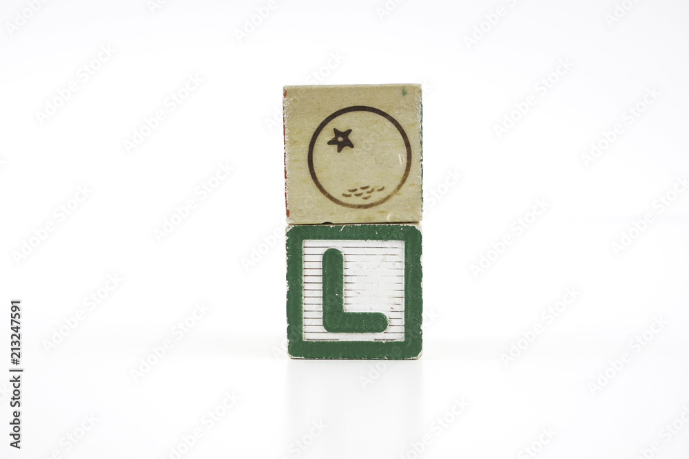 Colored wooden letter blocks on a white background with copy space Colored wooden letter blocks on a white background with copy space