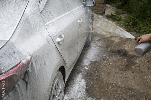 Car washing. Cleaning Car Using High Pressure Water