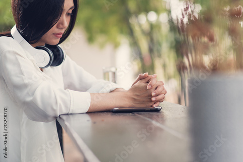 Woman prayer, Asian woman believe in the prayer to God, Christian student pray for study to pass the exam at the college . Bible and christian study concept