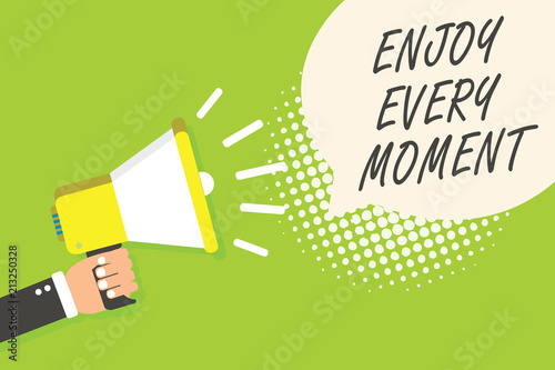 Writing note showing Enjoy Every Moment. Business photo showcasing being pleased with your life Have fun Precious time Speaker announcement alarming signal indication script symbol warning. © Artur