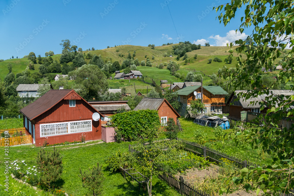 The countryside with wooden houses in the mountains The countryside with wooden houses in the mountains