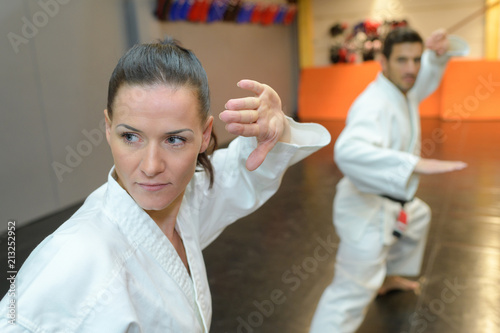 man and woman in karate class