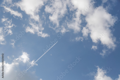 Plane in the clouds from below