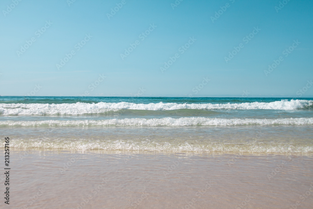 Rows of waves approaching the beach