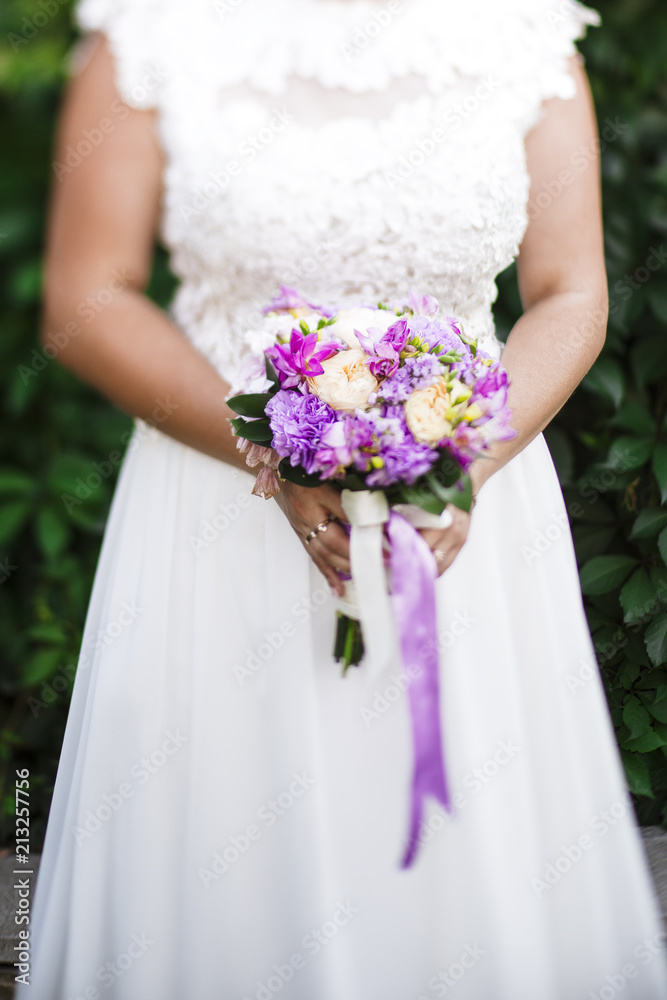 Purple bouquet with wedding dress Purple bouquet with wedding dress