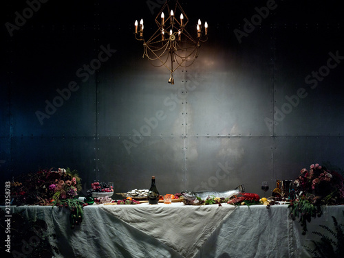 Long table with food and flowers photo