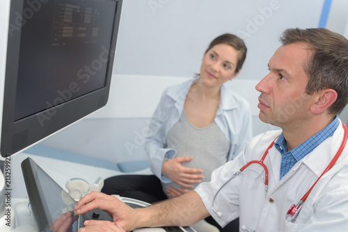 professional doctor screening of pregnant woman by ultrasound