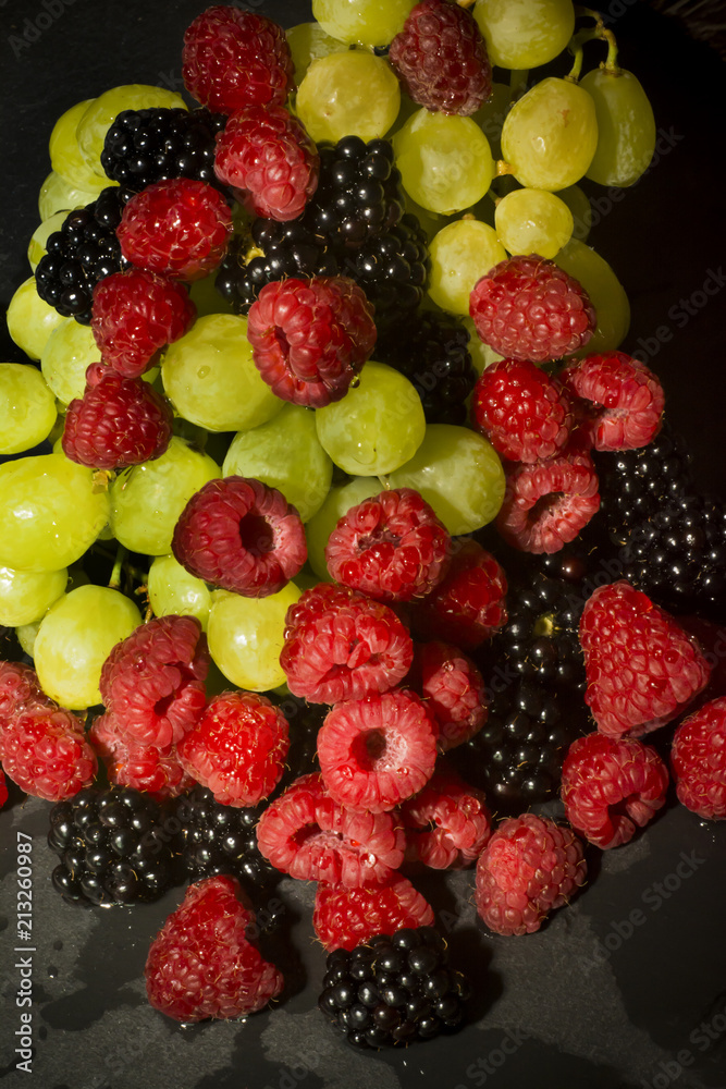 Fototapeta premium Varied fruit, blackberry, raspberry and grapes