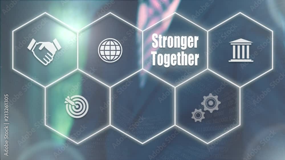 A businessman's hand selecting a Stronger Together concept button on a futuristic computer screen. A businessman's hand selecting a Stronger Together concept button on a futuristic computer screen.