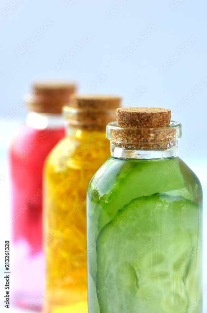 Three glass vial bottles of fresh natural plant based skin care facial toners with copy space. Organic herbal, plant and flower infusions for face and body. Cucumber, marigold and rose.
Three glass vial bottles of fresh natural plant based skin care facial toners with copy space. Organic herbal, plant and flower infusions for face and body. Cucumber, marigold and rose.
