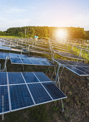 Solar panels (solar cell) in solar farm with sun lighting to create the clean electric power