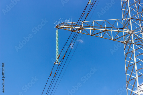 Power pylons and high-voltage lines against the background of the cloudy sky, power lines.