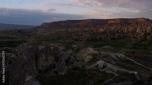 Morning Time lapse over Grand Canyon with Specific Formations And Plateau of Mount Akdag in Cappadocia Turkey. photo