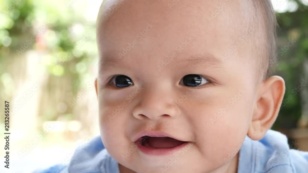Slow motion Baby laying on bed and laughing happy time Slow motion Baby laying on bed and laughing happy time