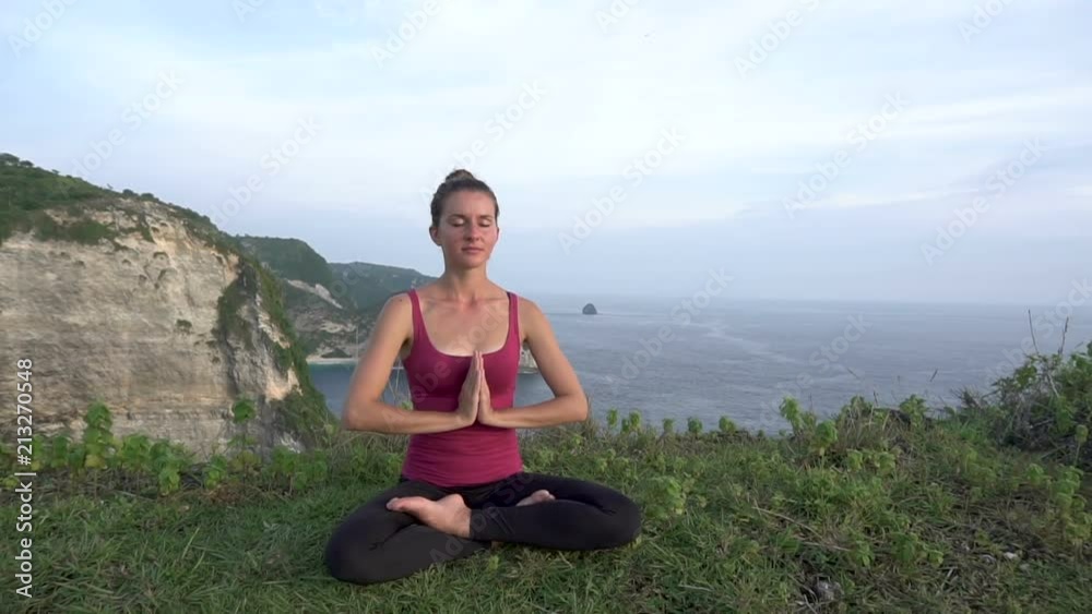 Yoga woman. Lotus pose on nature background Yoga woman. Lotus pose on nature background