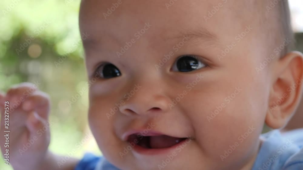 Slow motion Baby laying on bed and laughing happy time Slow motion Baby laying on bed and laughing happy time