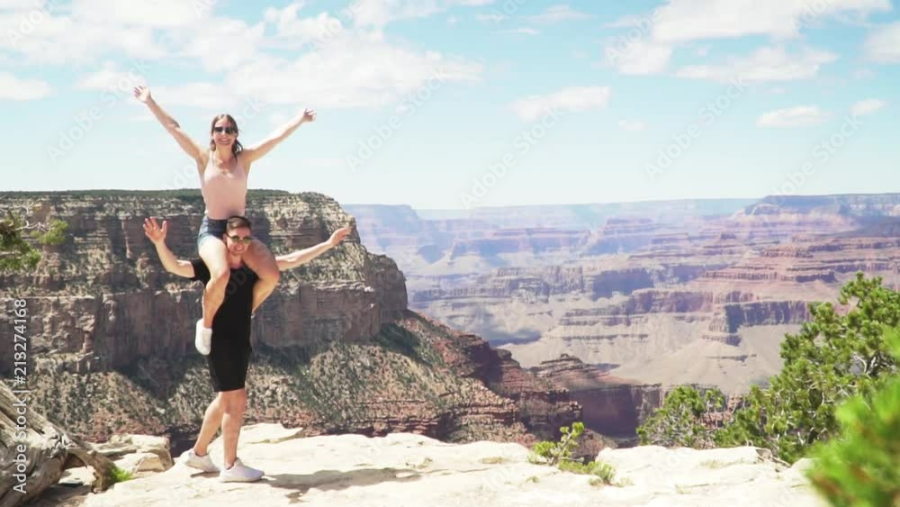 Cute couple posing in front of Grand Canyon Cute couple posing in front of Grand Canyon