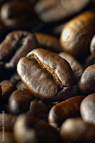 Medium roasted coffee beans shot at an angle © Расул Искандаров