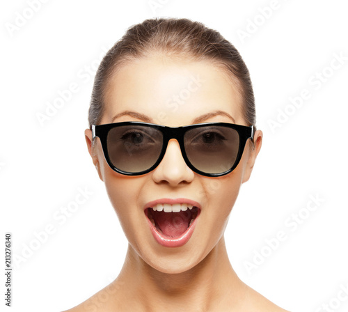 face expressions and people concept - portrait of excited young woman or teenage girl in black 3d glasses