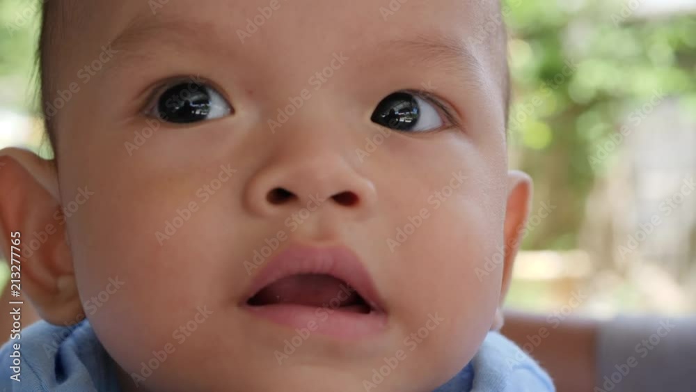 Slow motion Baby laying on bed and laughing happy time Slow motion Baby laying on bed and laughing happy time