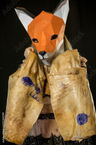 Blonde Girl with Fox Mask paper Using Pig Skin for Covering. photo